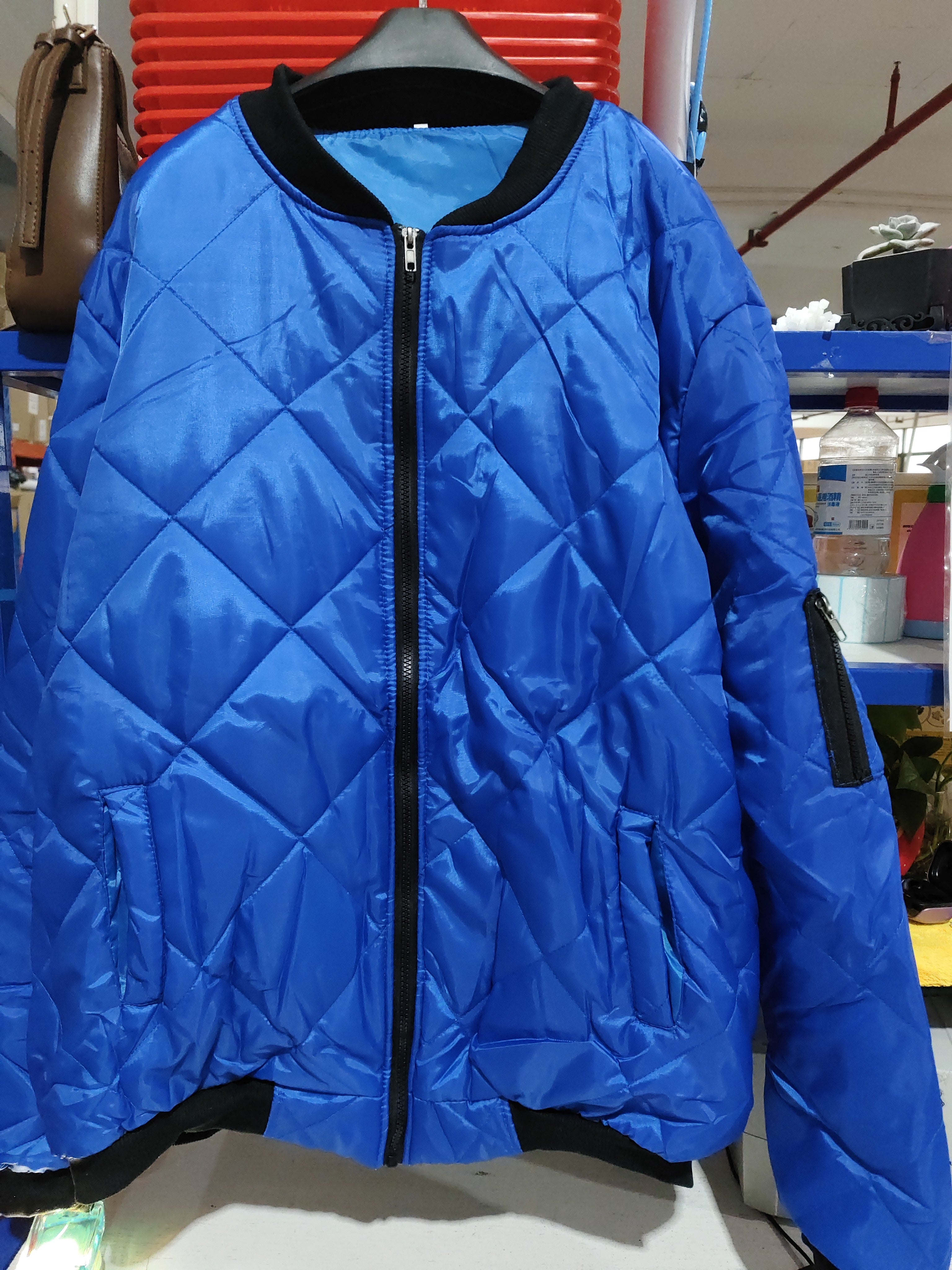 Solid color blue winter stand collar coat for men, featuring a zipper placket and urban style, available in various sizes.